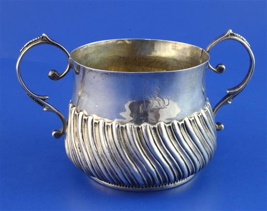 A George III demi-wrythened repousse silver porringer, 8 oz.